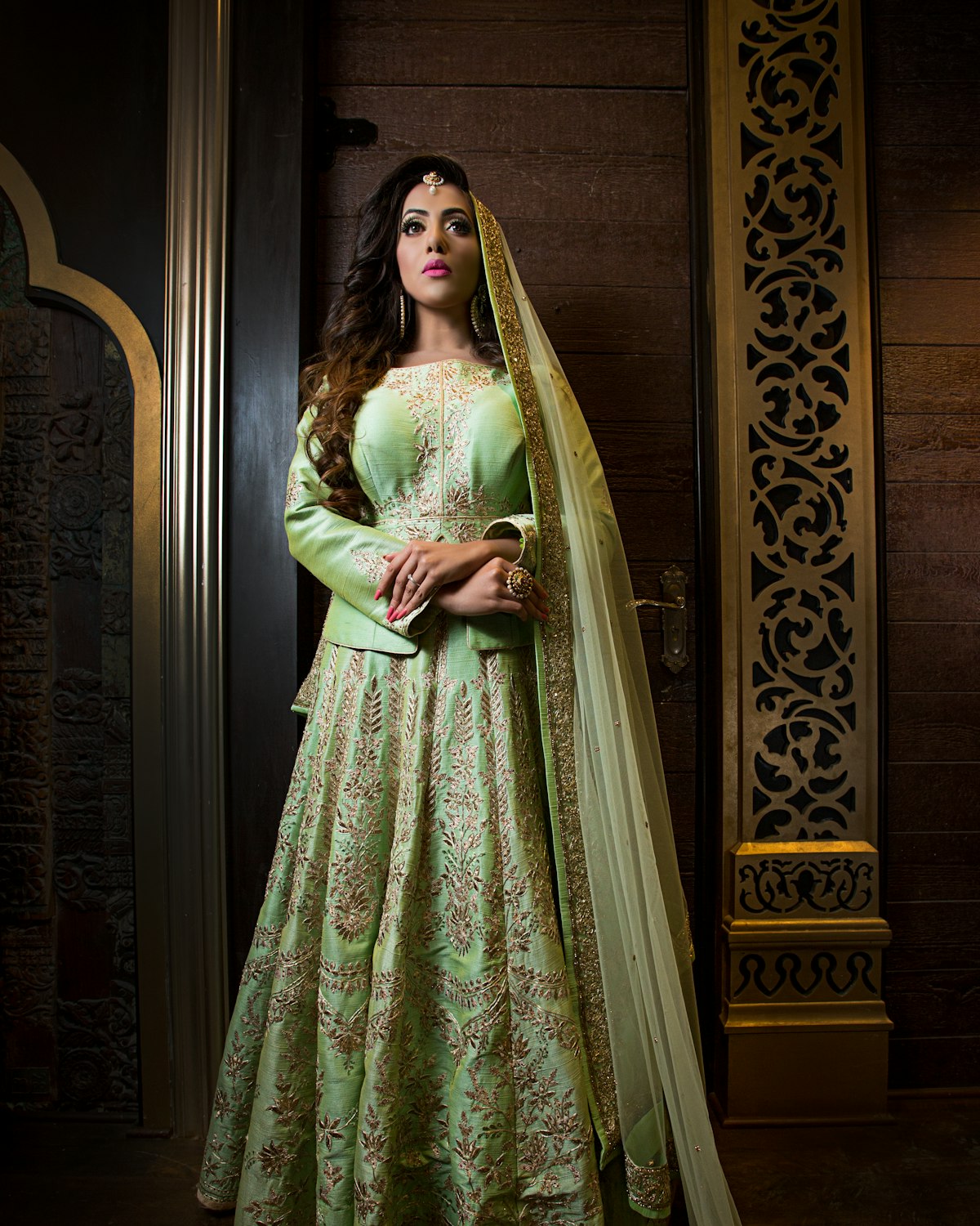 Woman in a mint embroidered lehenga